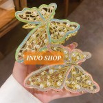 Pinza con forma de mariposa con perlas
